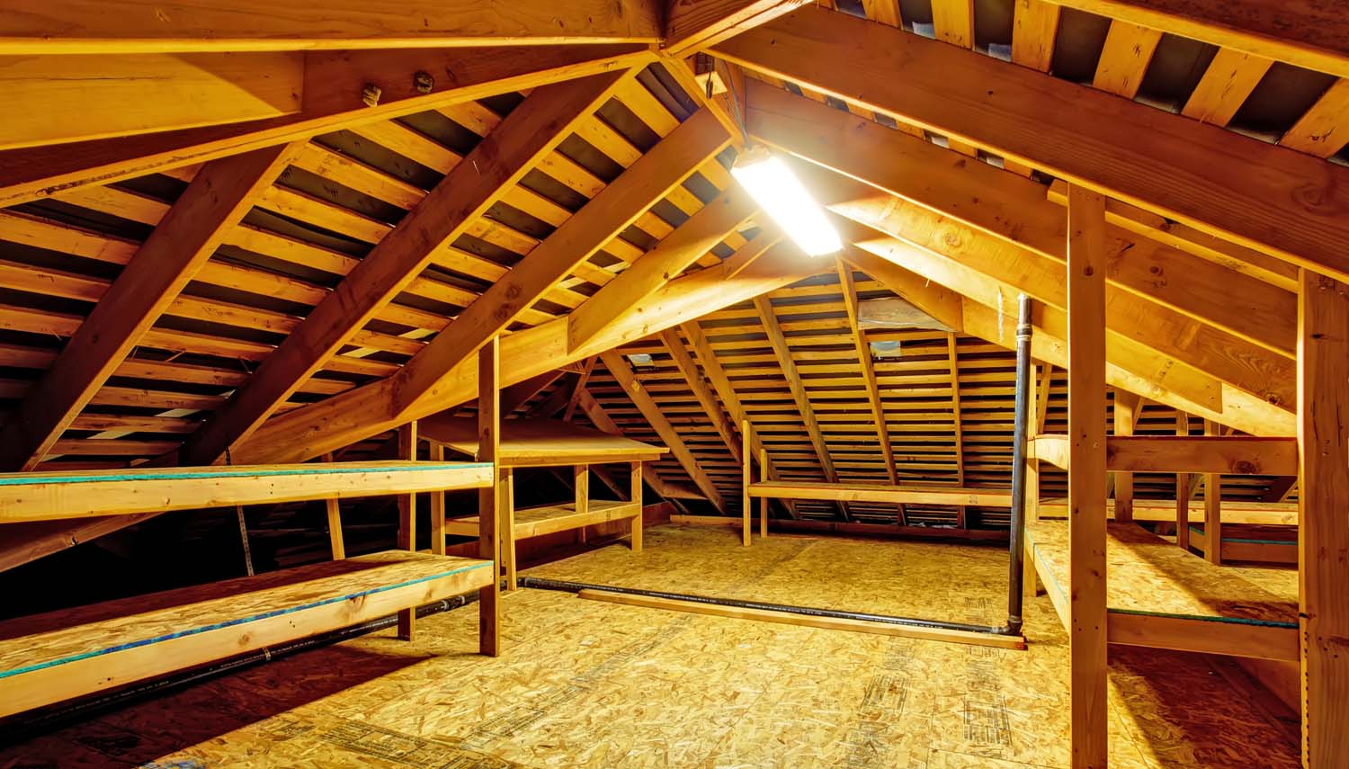 interior of attic venting near san antonio tx showing the space showing rafters and window