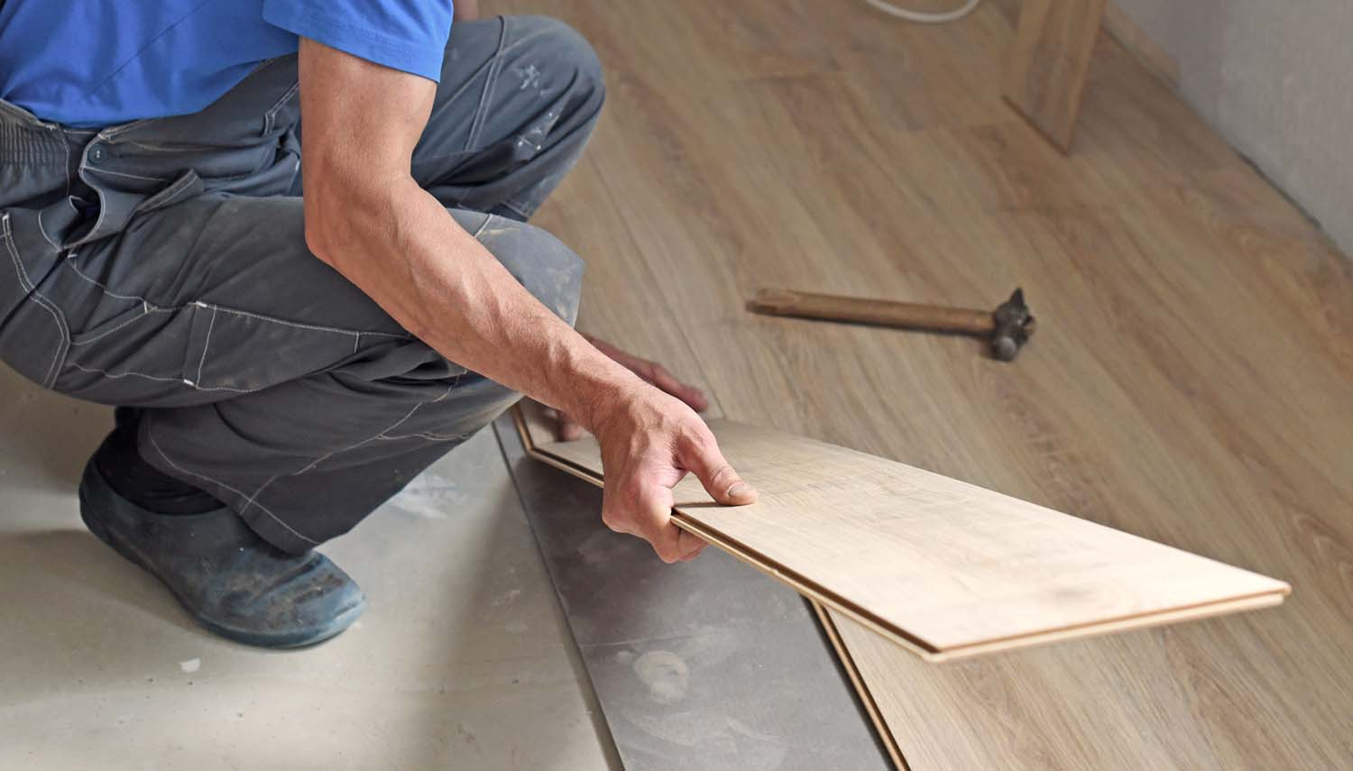 contractor is installing hardwired floor piece by piece