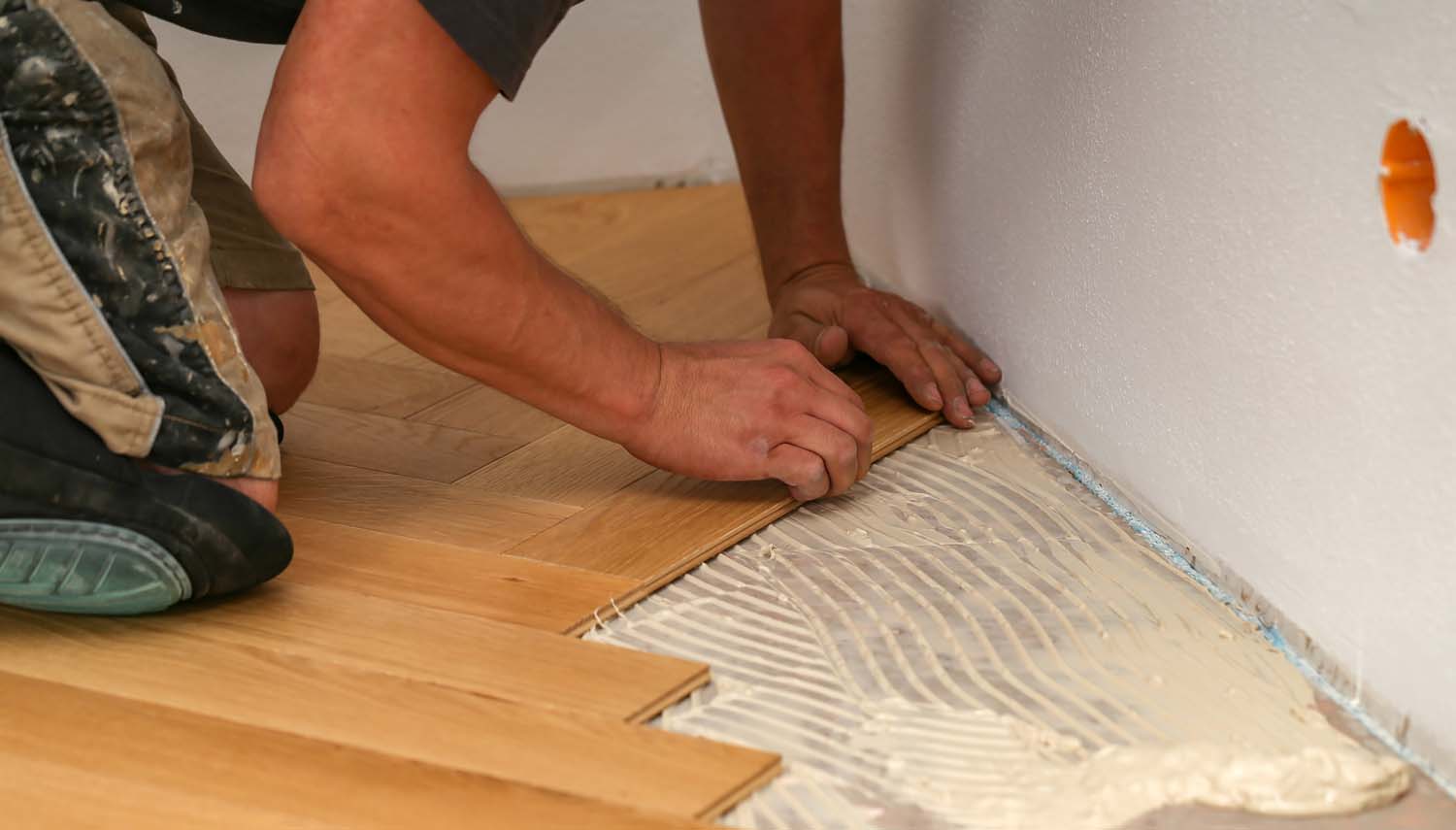 flooring installer on his needs installing a new floor