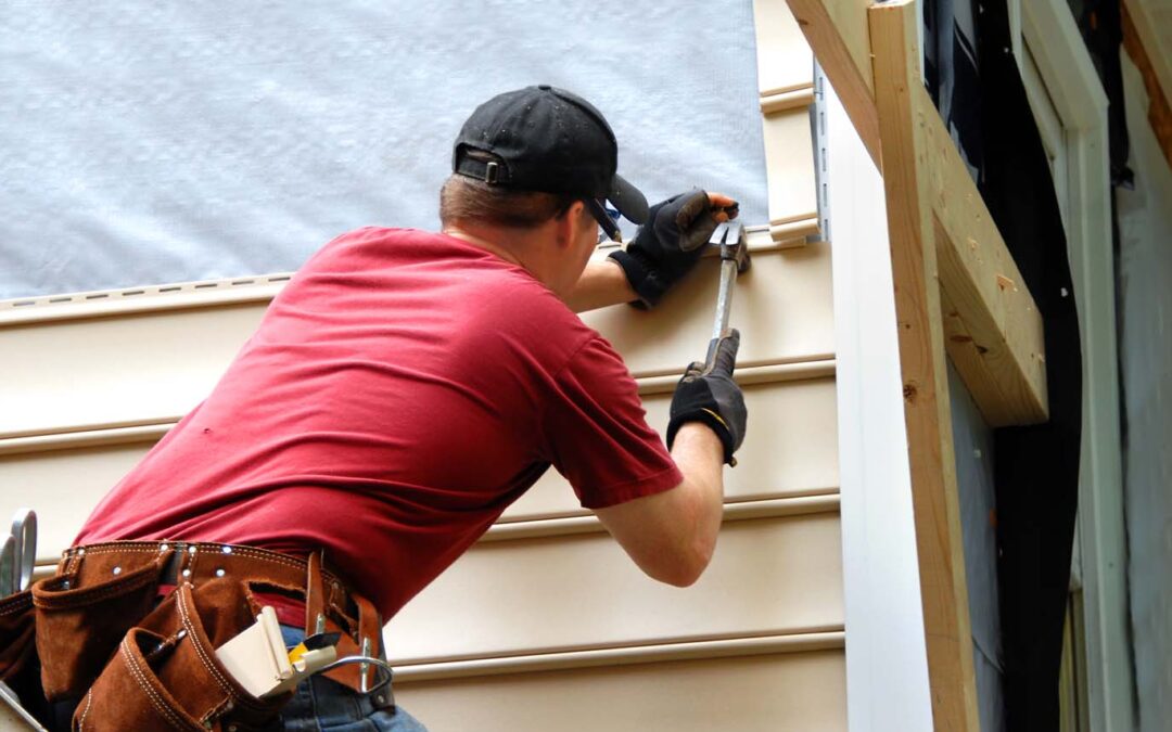 roofing contractor installing siding