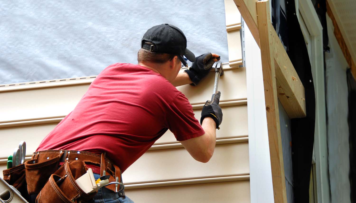 roofing contractor installing siding