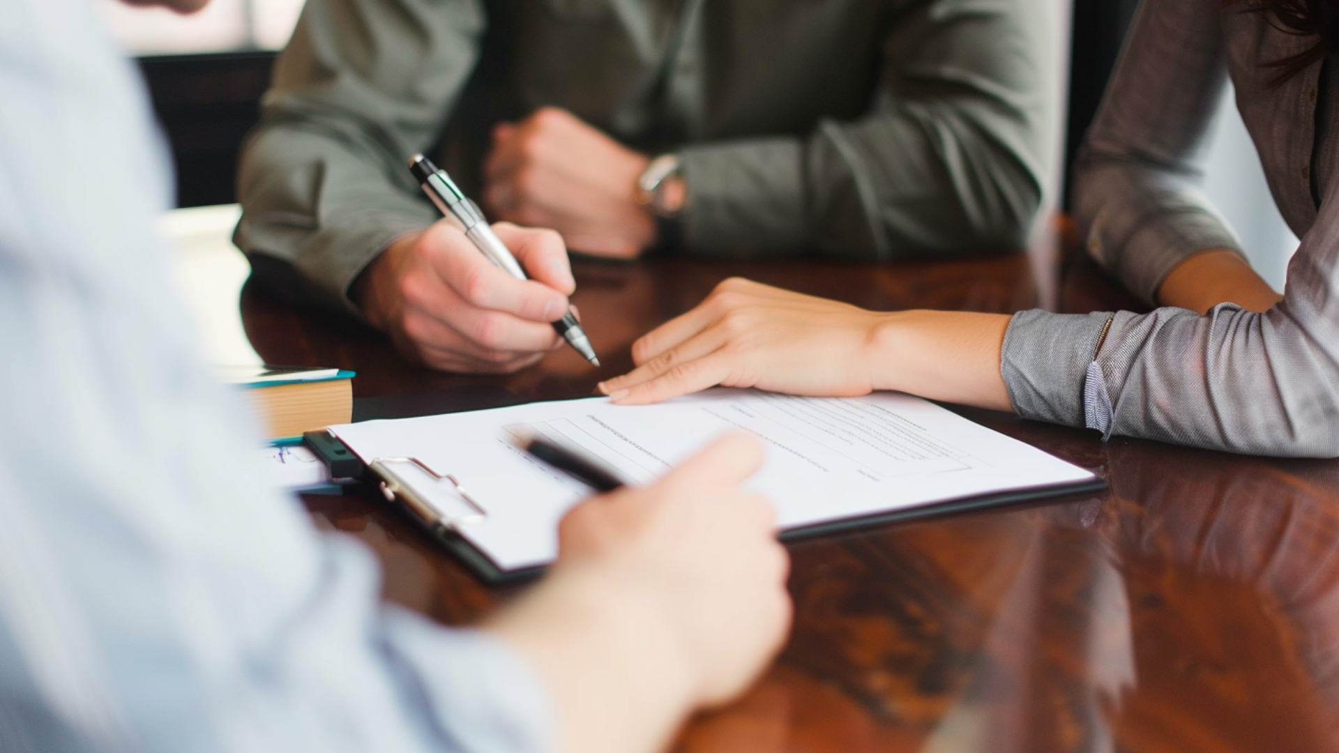 An image of a person talking and needed to sign a paper document