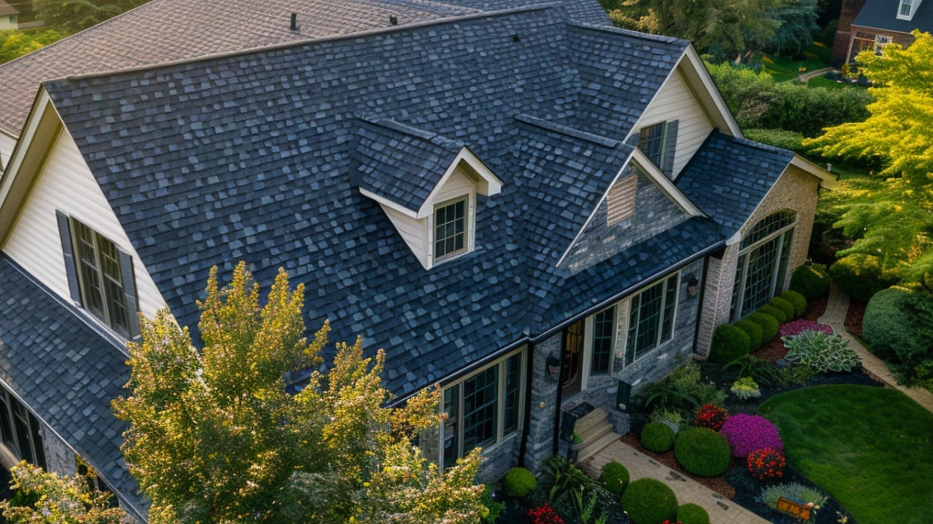 Imagine a semi-top view of a suburban house featuring asphalt roofing. The perspective is slightly elevated, capturing the roof's texture and color details up close.