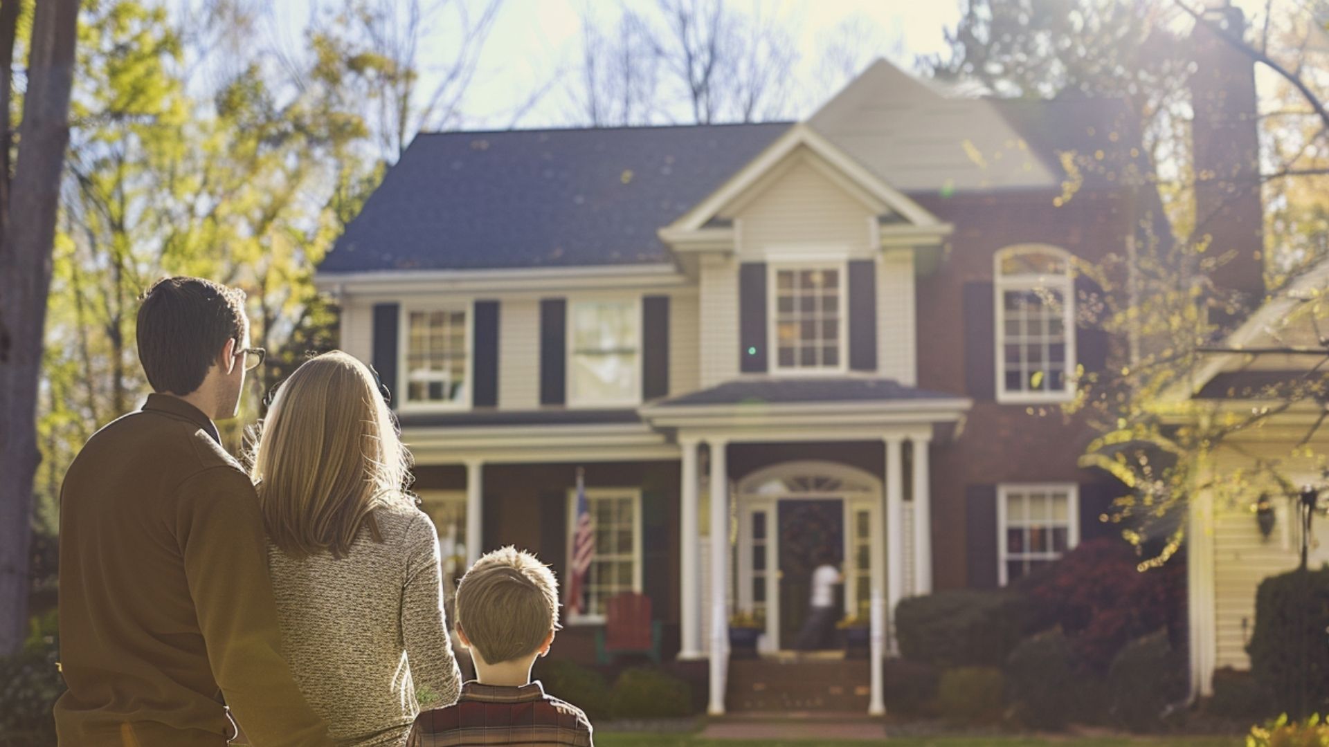 an image of a family outside the house looking at the newly installed rubber roof.